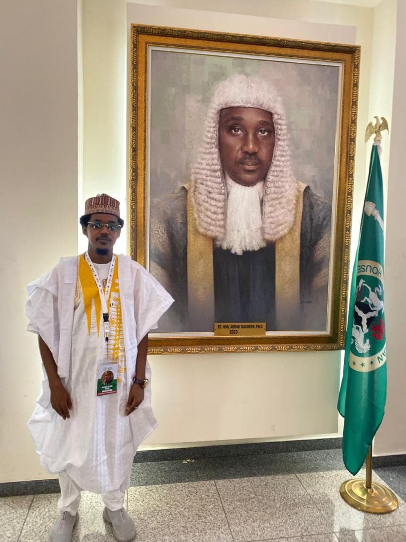 Maharaz at the House of Representatives beside the Speaker's portrait