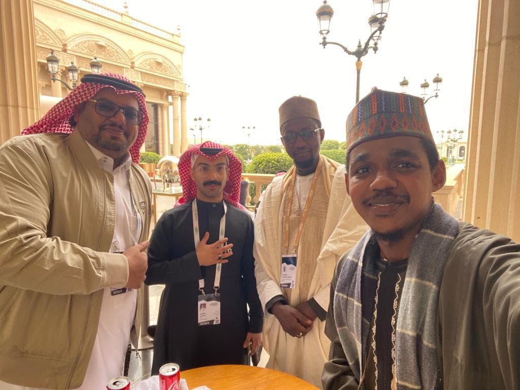Selfie of Maharaz with three delegates on a terrace