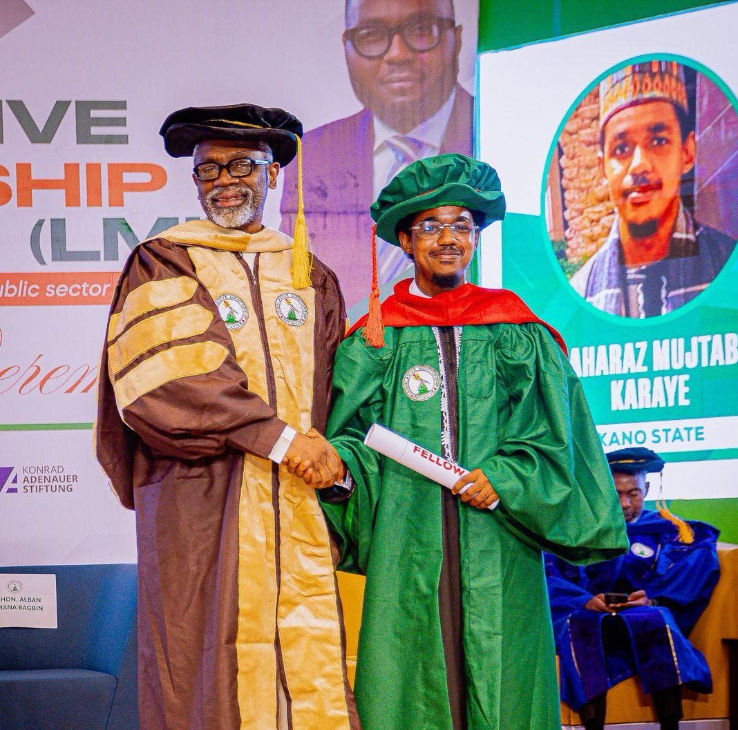 Maharaz receiving his Legislative Mentorship Initiative fellowship scroll on stage
